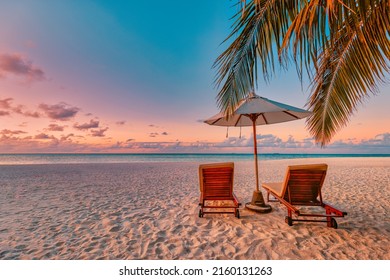 Amazing sunset beach. Romantic couple chairs umbrella. Tranquil togetherness love concept scenery, relax beach, beautiful landscape design. Getaway tropical island shore, palm leaves, idyllic sea view - Shutterstock ID 2160131263