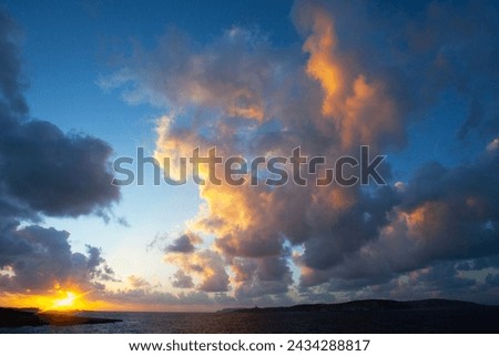 Amazing sunset  with clouds and meditterranean sea on the north of Malta, near the Coral Lagoon