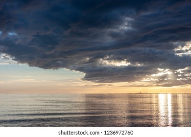 amazing sunset over the sea with dramatic clouds