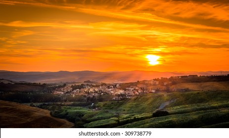 Amazing Sunset Over Small Tuscan Town In Italy