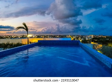 Amazing Sunset Sunrise And Night Cityscape Landscape And Caribbean Ocean And Beach Panorama View At Infinity Pool On Rooftop In Playa Del Carmen In Quintana Roo Mexico.