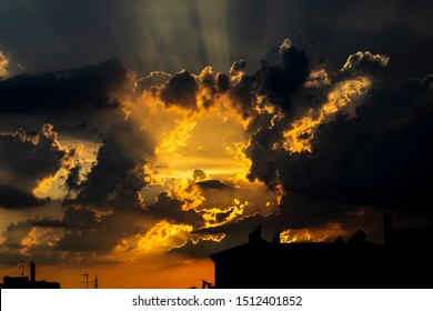 Amazing Sunset Through The Clouds.