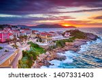 Amazing sunset view from the walls of the citadel of Calvi, the old town with historic buildings. Luxurious marina and very popular tourist destination. Corsica, France, Europe
