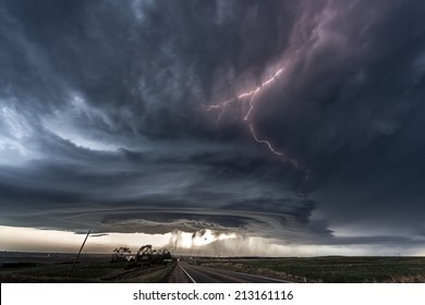 Amazing supercell lighted up by lightnings at dusk