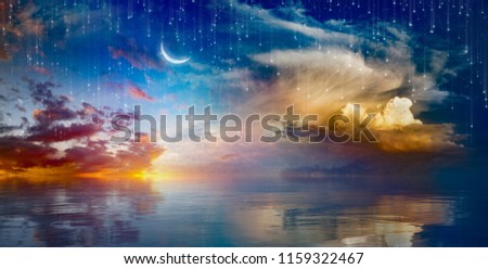 Amazing surreal background - crescent moon rising above serene sea in sunset sky, glowing horizon and falling stars.  Elements of this image furnished by NASA