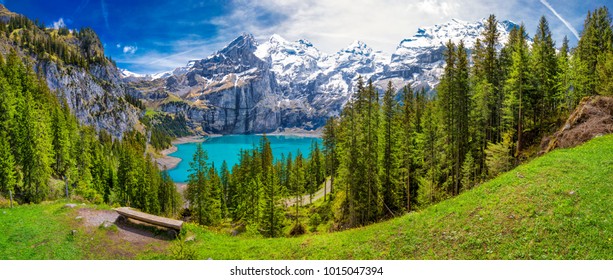 Amazing tourquise Oeschinnensee with waterfalls and Swiss Alps, Kandersteg, Berner Oberland, Switzerland. - Shutterstock ID 1015047394