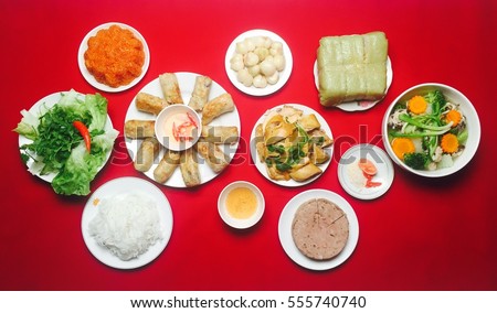 Amazing of Vietnamese food for Tet holiday in spring, it is traditional food on lunar new year: Banh chung, Boiled chicken, pickled onions, spring rolls ...
