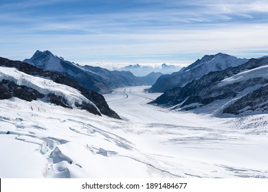 Amazing view of Aletsch Glacier, the largest glacier in the Alps, world heritage of Swiss and Bernese alps alpine snow mountains peaks, beautiful landscapes view downhill from the top of Jungfraujoch. - Shutterstock ID 1891484677