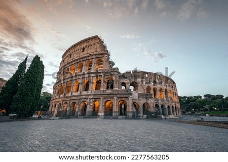 Amazing view of the Colosseum at beautiful warm light at sunrise, Rome, Italy.	