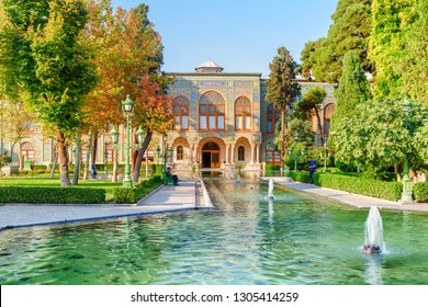 Amazing view of the Golestan Palace and beautiful fountains among green gardens in Tehran, Iran. The Golestan Palace is a popular tourist attraction of the Middle East. Traditional Persian exterior.