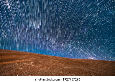 An Amazing View Of The Milky Way Rising In Atacama Desert Night Sky While The Moon Sets. An Awe View Of The Stars And All The Artificial Satellites Space Traffic As Moving Stars Above The Desert Field