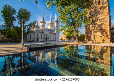 Amazing view on Saint Nicholas Orthodox Church reflected in the glass on central square of Baia Mare, main city of Maramures County, Romania. - Shutterstock ID 2176157093