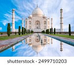 Amazing view on the Taj Mahal with reflection in water. The Taj Mahal is an ivory-white marble mausoleum on the south bank of the Yamuna river. Agra, Uttar Pradesh, India. 