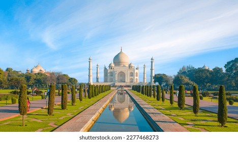 Amazing view on the Taj Mahal with reflection in water at sunny day - Agra, Uttar Pradesh, India