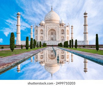 Amazing view on the Taj Mahal with reflection in water. The Taj Mahal is an ivory-white marble mausoleum on the south bank of the Yamuna river. Agra, Uttar Pradesh, India.  - Powered by Shutterstock