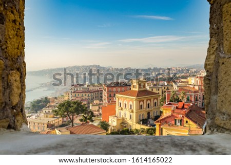 amazing view of the roofs of Napoli, Italy trough medieval rock window