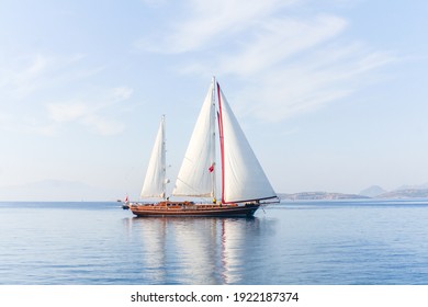 Amazing View To Sailboat With White Sails In The Sea