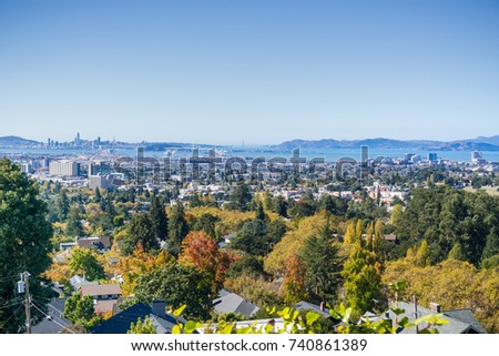 Amazing view of the San Francisco bay from a residential area in Oakland on a sunny autumn day; San Francisco and Marin Headlands in the background; California