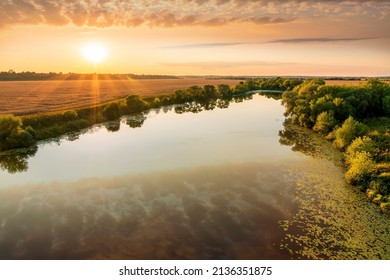 Amazing View At Scenic Landscape On A Beautiful River And Colorful Sunset With Reflection On Water Surface And Glow On A Background, Spring Season Landscape