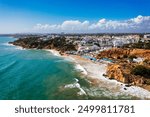 Amazing view from the sky of town Olhos de Agua in Albufeira, Algarve, Portugal. Aerial coastal view of town Olhos de Agua, Albufeira area, Algarve, Portugal.