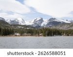 An amazing view of Sprague Lake and the Rocky Mountains in Rocky Mountain National Park in Colorado. 