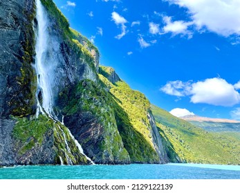 Amazing view of turquoise mountain lake and waterfall in Torres del Paine National Park of Patagonia, Chile