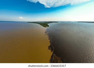 Amazing view of two rivers Negro and Amazon meeting in Manaus Brazil from above - Powered by Shutterstock