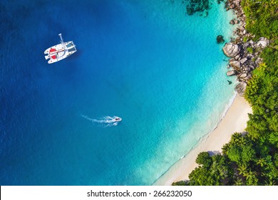 Amazing View To Yacht In Bay With Beach - Drone View. Birds Eye Angle