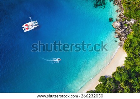 Amazing view to Yacht in bay with beach - Drone view. Birds eye angle