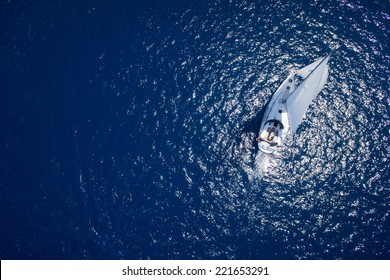 Amazing view to Yacht sailing in open sea at windy day. Drone view - birds eye angle
