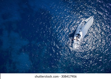 Amazing View To Yacht Sailing In Open Sea At Windy Day. Drone View - Birds Eye Angle