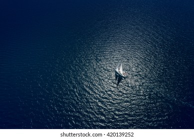 Amazing view to Yacht sailing in open sea at windy day. Drone view - birds eye angle. Yachting theme. - Shutterstock ID 420139252