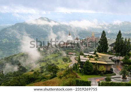 Amazing Wat PhraThat PhaSon Kaew Temple, Khao Kho,Phetchabun,Thailand,The top of the view art of culture at landmark in Thailand  Misty mountain in the morning view
