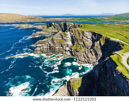 Amazing wave lashed Kerry Cliffs, widely accepted as the most spectacular cliffs in County Kerry, Ireland. Tourist attractions on famous Ring of Kerry route.