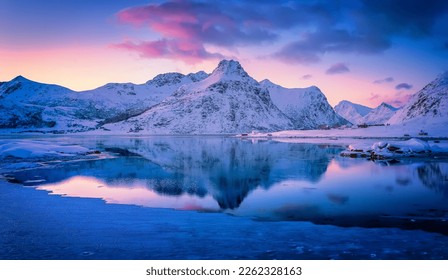 Amazing winter nature scenery. Colorful sky over the sea, snowy mountains and north fjord snow covered mountains. Norway. Lofoten islands during sunset, Stunning Norway landscape. Picturesque Wintr - Powered by Shutterstock