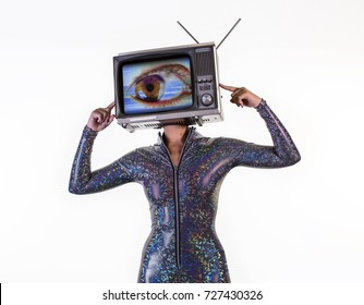 amazing woman dancing and posing with a television as a head. the tv has a large eye on it