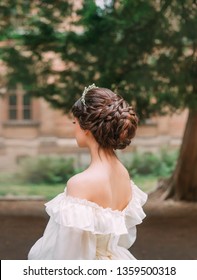 Amazing Work Of Professional Hairdresser, Gentle Bridal Hairstyle Long Dark Brown Hair, Tiara For Prom Evening, Braided Curls For Girl In White Dress With Open Shoulders And Back, No Face Turned Away