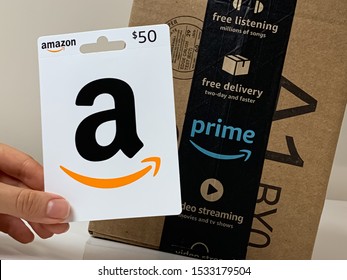 Amazon gift card for $50 held by a customer. Amazon gift card can be used on Amazon.com to make online purchases. Brooklyn, New York, USA October 1, 2019.