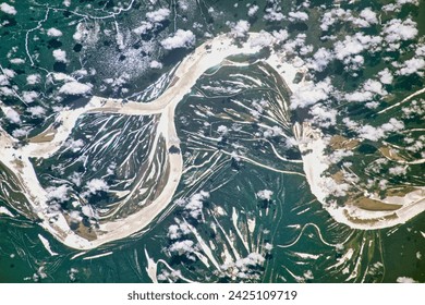 Amazon Meanders in Sunglint. The largest river in the world is full of bends and meanders, a result of the water course snaking back and forth. Elements of this image furnished by NASA.