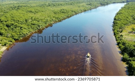 Amazon Rainforest natural landscape. Amazon river scene. Green background. Amazonia forest. Aerial nature landscape of famous amazon river.