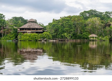 Amazon river rainforest lodge reflection, Yasuni national park, Ecuador.
