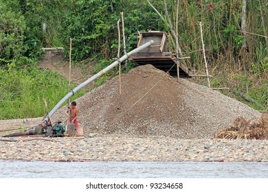 AMAZONIA, PERU - CA NOV 2011 - Local Peruvians Participate In Illegal Gold Mining Along The Madre De Dios River. This Activity Has Forced The Tribes To The Riverbank Where Fatal Conflicts Arise.