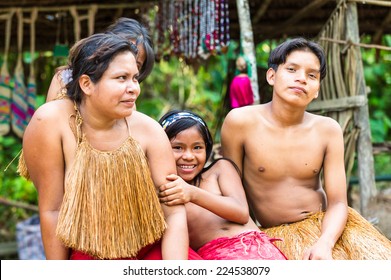 AMAZONIA, PERU - NOV 10, 2010: Unidentified Amazonian Indigenous Family. Indigenous People Of Amazonia Are Protected By COICA (Coordinator Of Indigenous Organizations Of The Amazon River Basin)