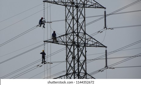 Amazung Scene At 70 Metre Heights When Couples Of Brave Workers Doing Stunning Repairing Job At Electric Substation Tower In Malacca, Malaysia.