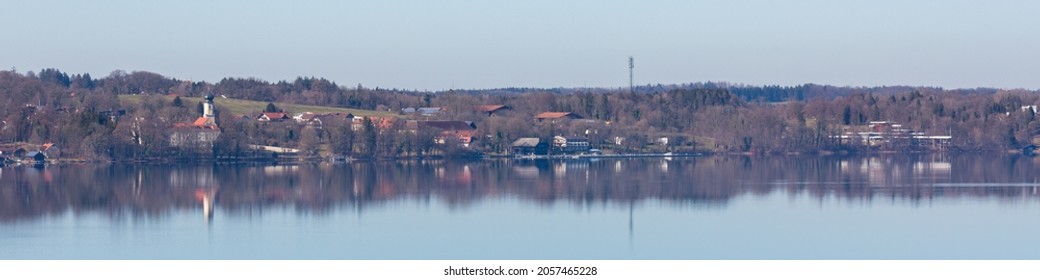 Ambach, Germany - Mar 2, 2021: Panorama view of Bernried - a small town at Lake Starnberg (Starnberger See). With Museum der Phantasie on the right.