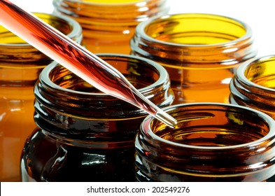 Amber Bottle And Dropper In Laboratory Testing For New Drug Or New Substance Development.