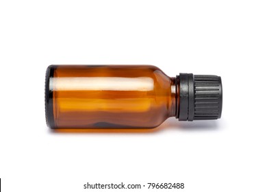 Amber color small pharma grade empty glass bottle with black cap and dropper.