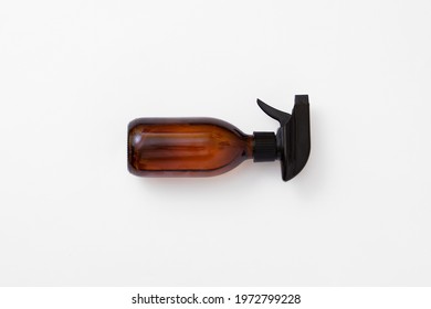 Amber colored glass sprayer for cleaning - Shutterstock ID 1972799228