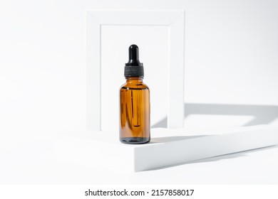 Amber Cosmetic Bottle With Pipette On White Podium, Product Packaging, Anti Aging Serum With Peptides, Cosmetics Mockup, Spa Concept