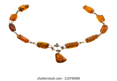 Amber gold color stone necklace isolated on white background.